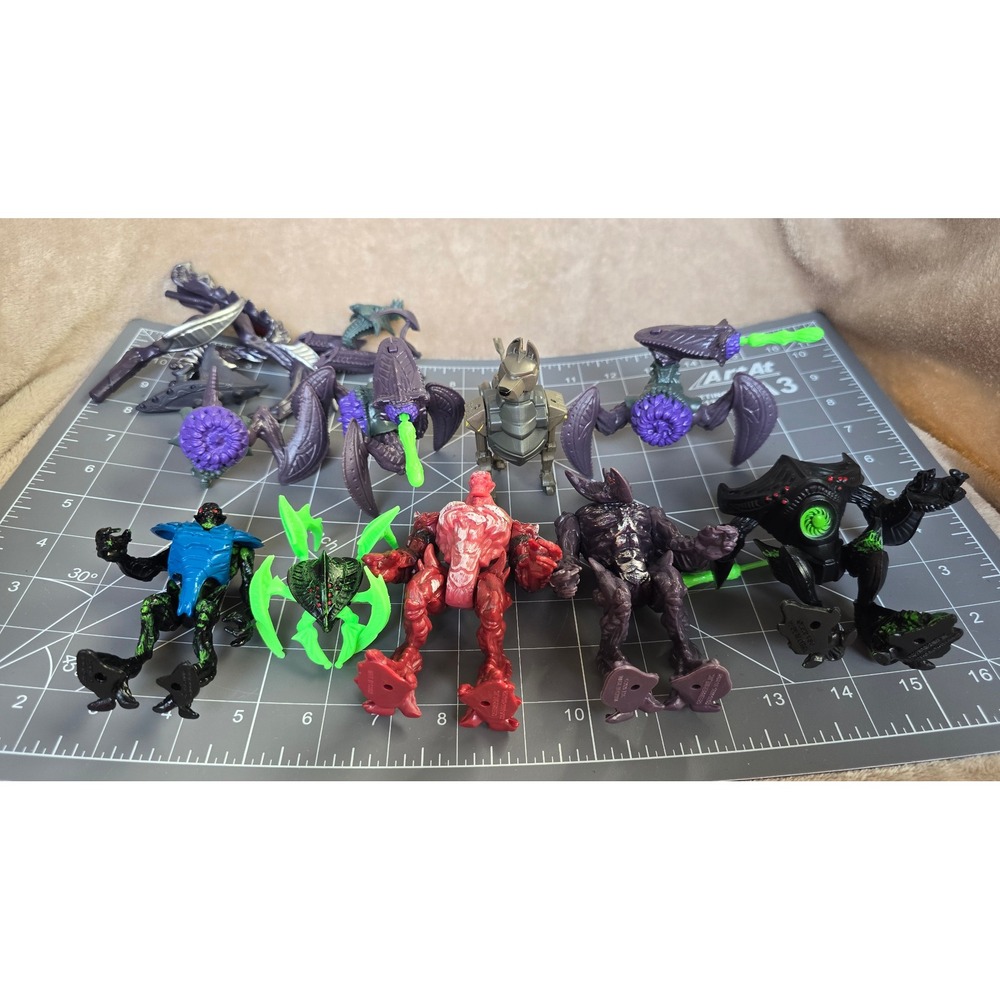 Final Faction action figures, including purple alien figures, robotic soldier
